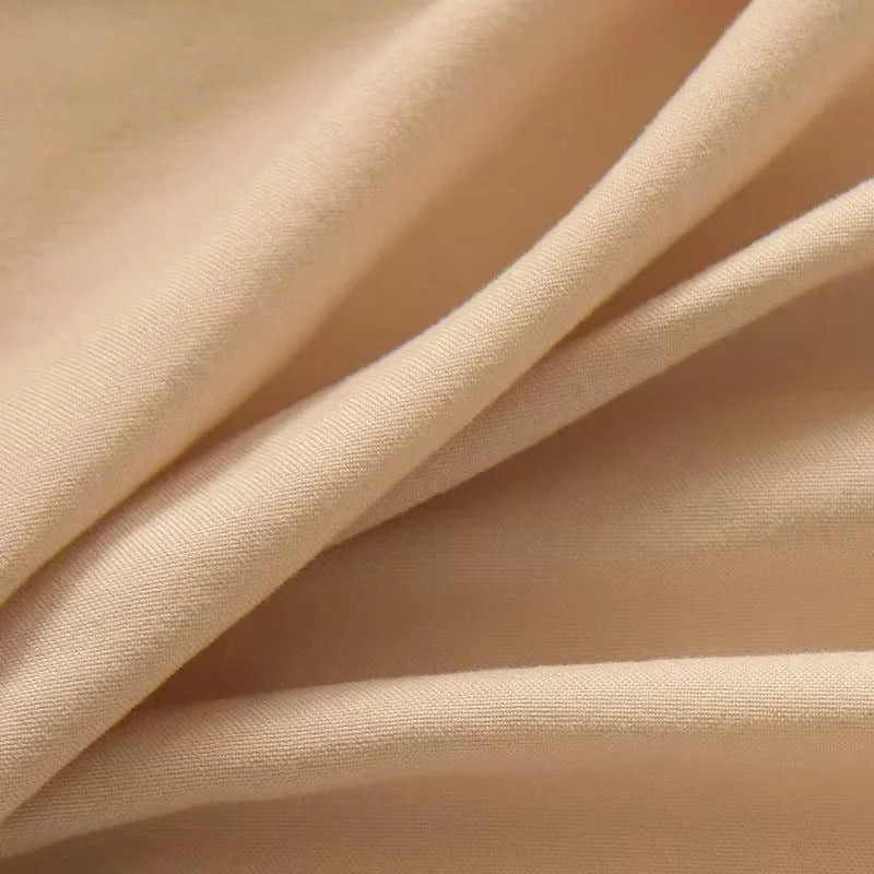 Alèse pour matelas de couleur pêche texture