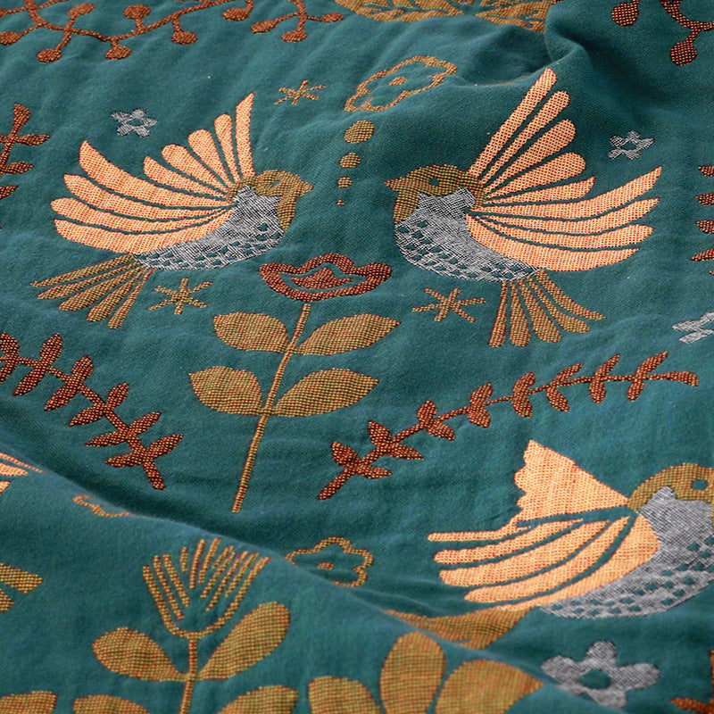 Couverture de lit avec des oiseaux