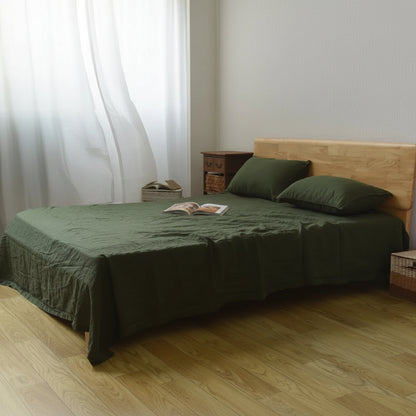 Drap plat en lin vert lit
